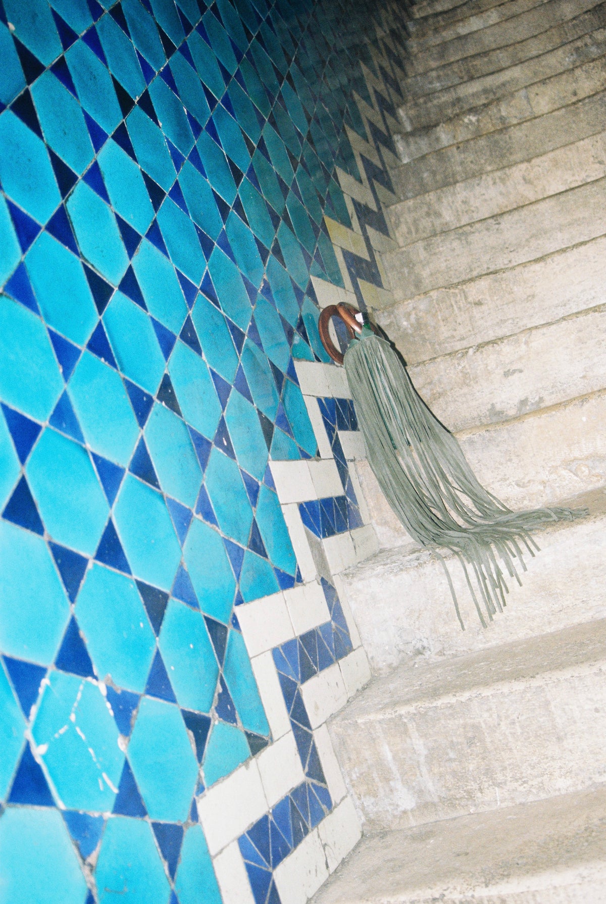 Üzüm wine bag resting on tiled stairs